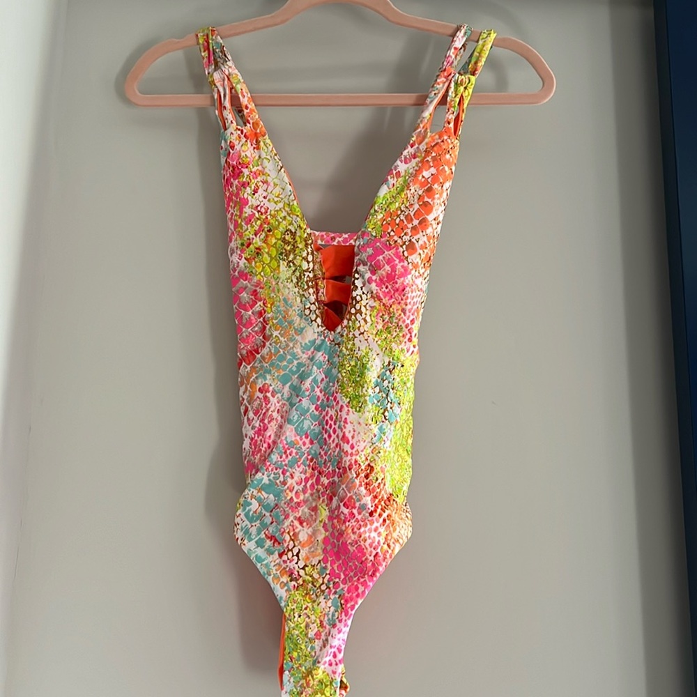 BECCA one piece swimsuit. Size Large. Multi-color. Great condition. Worn once.